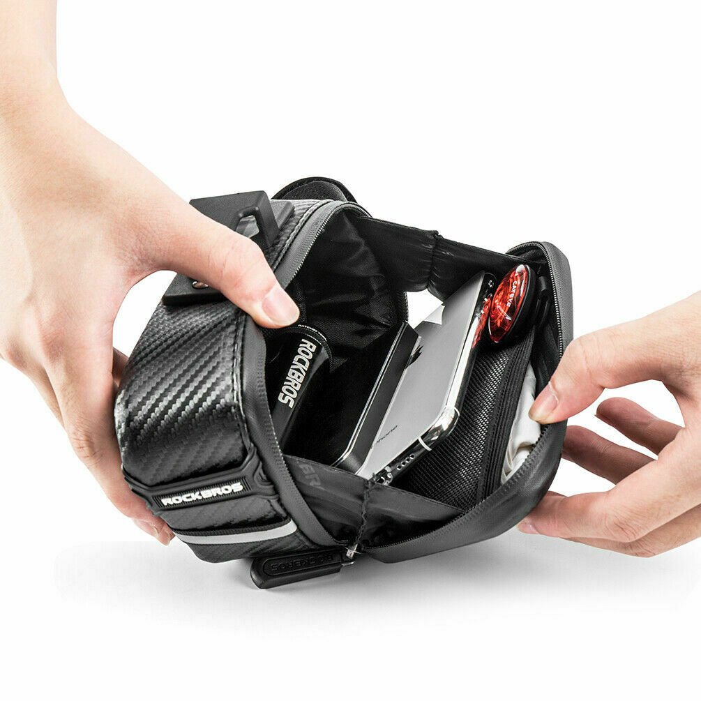 ROCKBROS rear seat bag being opened to reveal storage compartments.