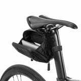 Open ROCKBROS rear seat bag with carbon fiber look on a bicycle saddle