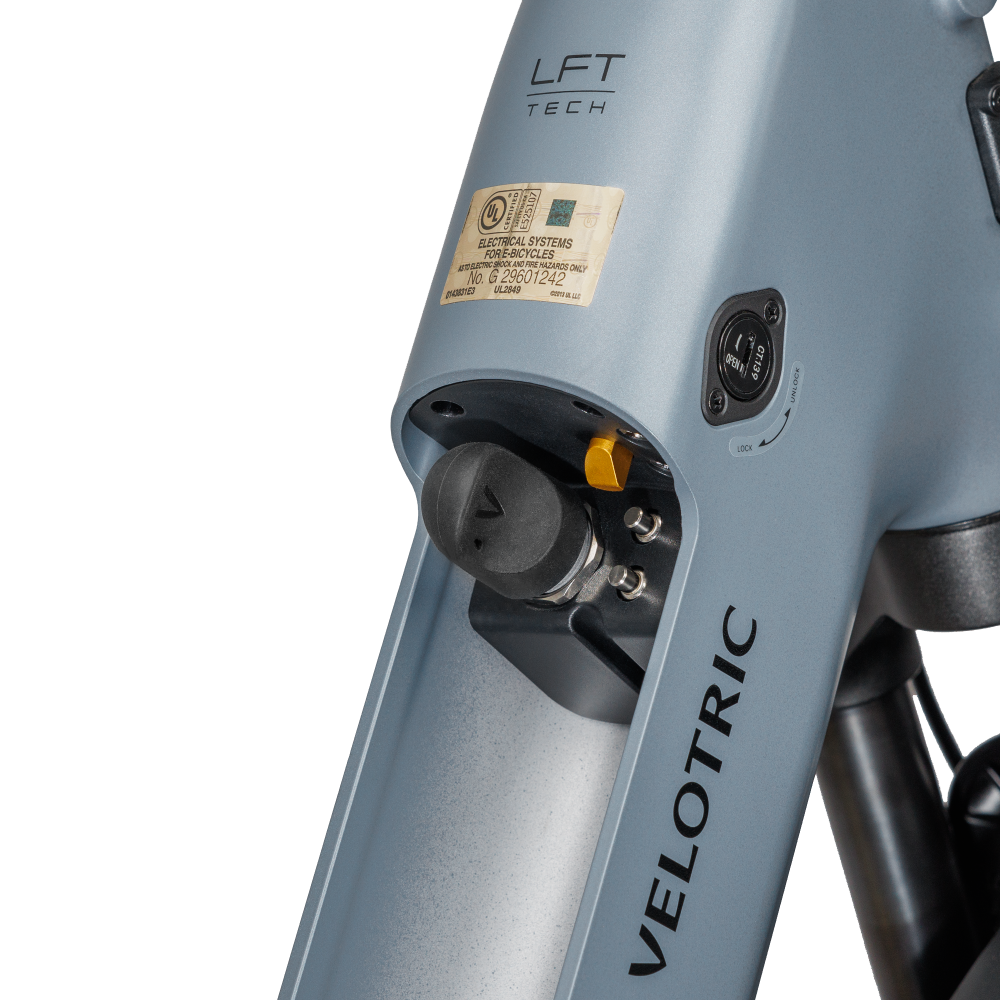 Velotric e-bike battery connector cover protecting electrical components