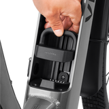 Hand showing Velotric battery terminal cover installation in e-bike frame