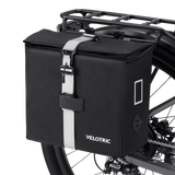 Velotric black Rear Rack Pannier Bag with detachable strap attached to bike rack