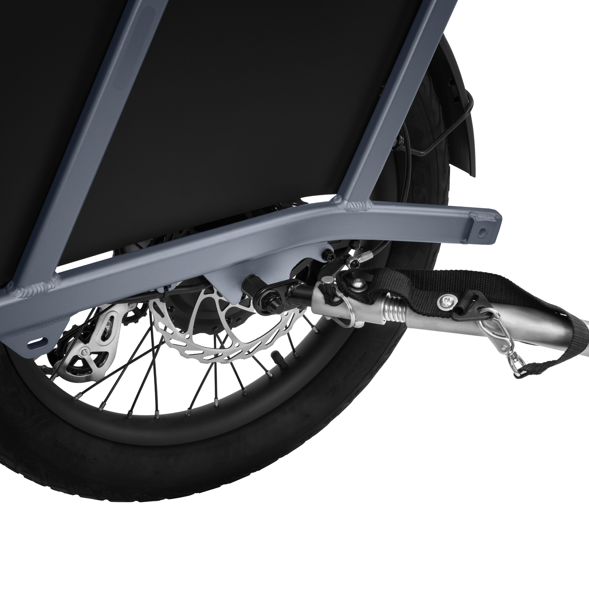 Velotric eBike trailer coupler secured to bike frame for transporting cargo.