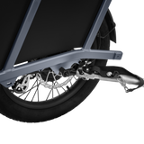 Velotric eBike trailer coupler secured to bike frame for transporting cargo.