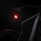 Lumos Firefly Smart Light in red mounted on Velotric e-bike seat post