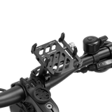 Velotric phone mount securely attached to bike handlebars for easy access.