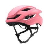 Lumos Ultra Fly helmet in pink with integrated smart lighting features.