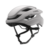 Lumos Ultra Fly helmet in white with smart lighting and adjustable fit.