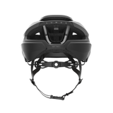 Rear view of Lumos Ultra Fly bike helmet in matte black with adjustable strap.